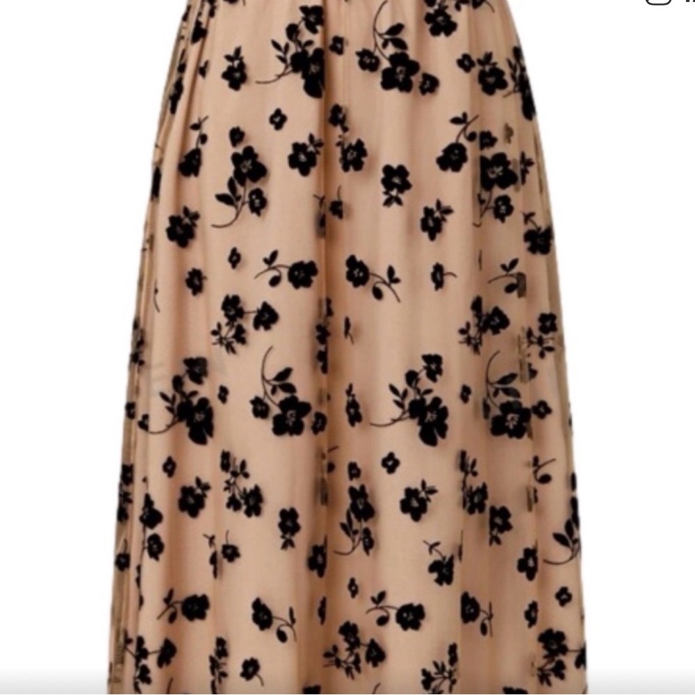 Unusual design on this medium midi skirt.Pink Mesh Overlay/Black Rose Appliques.